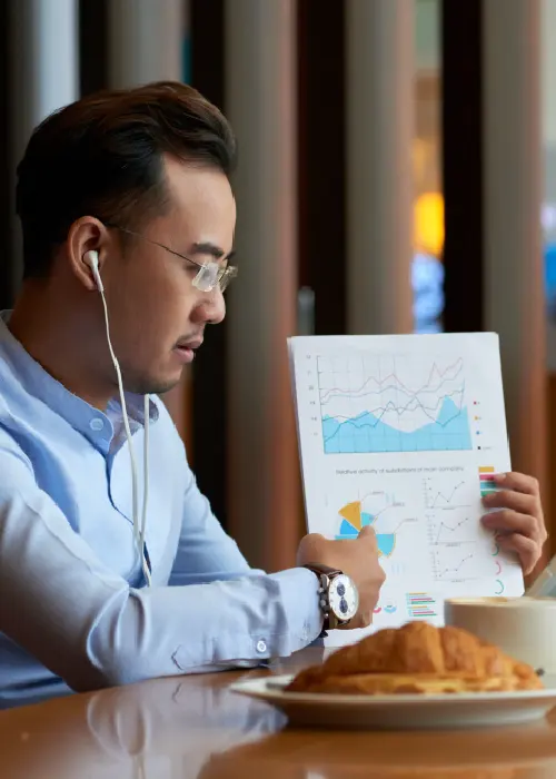 Professional reviewing charts on a tablet, representing AI conversation intelligence and call analytics insights