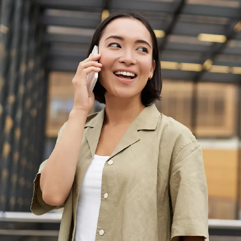 Woman on a phone call representing AI voice agent handling customer conversations