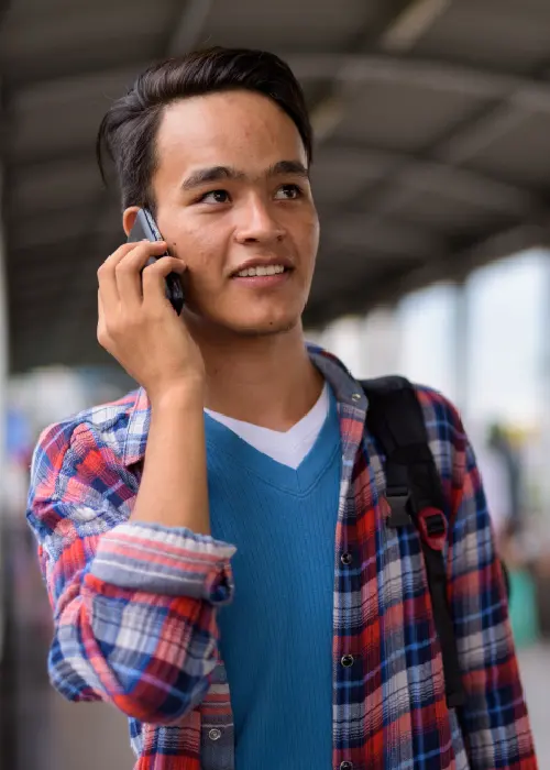 Man using a mobile phone symbolizing AI-powered voice agents for automated call handling