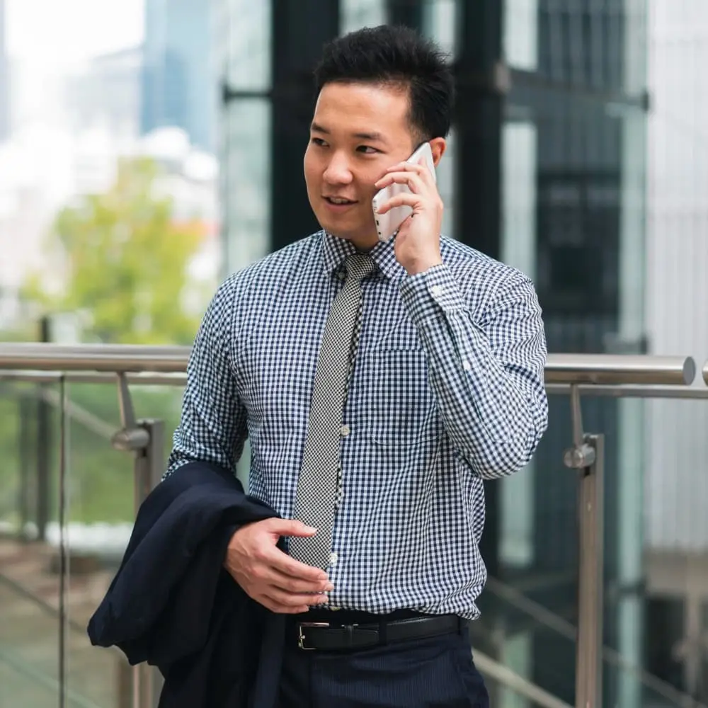 Business professional speaking on the phone, representing real customer conversations