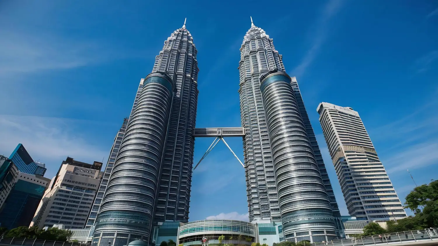 malaysia-landscape Kuala Lumpur skyline with Petronas Twin Towers representing AI voice agents supporting multiple languages across APAC