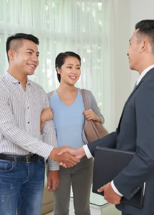 Business professionals shaking hands, representing automated actions and successful outcomes from AI-driven workflows