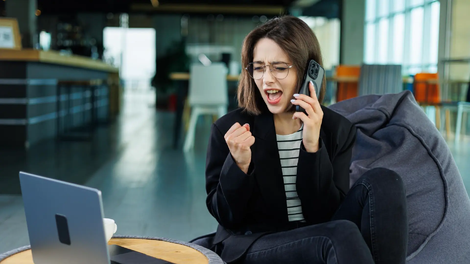 Businesswoman on a phone call during an outbound sales conversation in Singapore