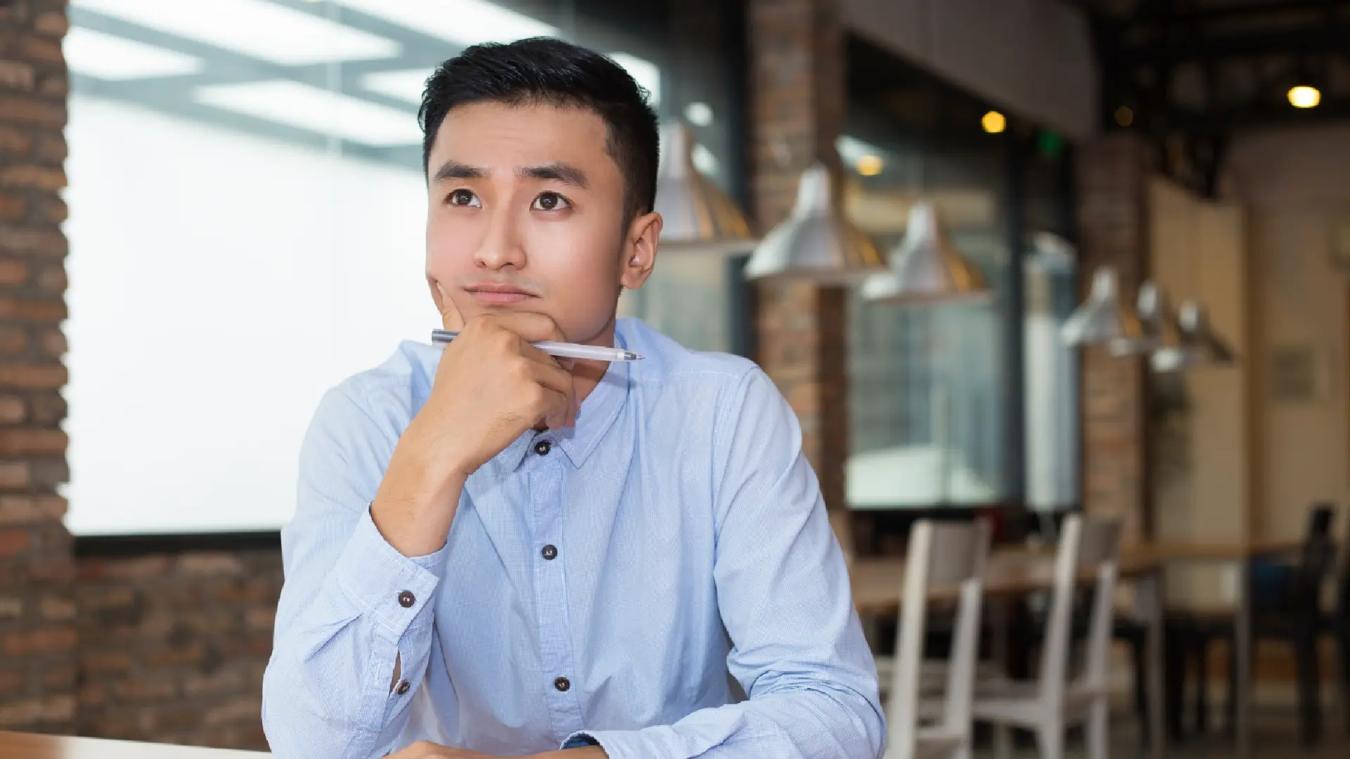 business-owner-evaluating-ai-voice-agent-options rofessional evaluating AI voice agent solutions before choosing a customer service automation platform.